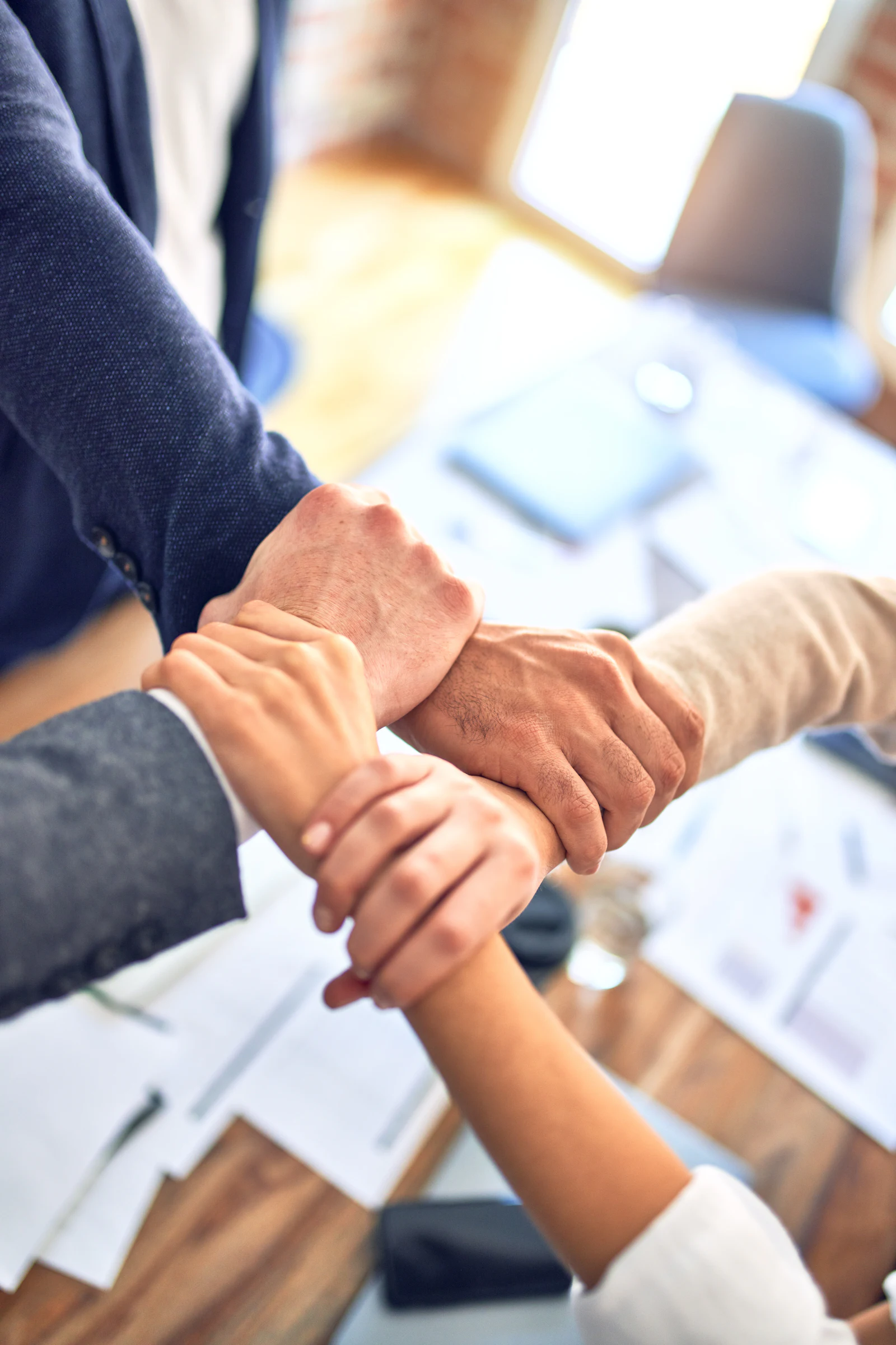 Two partners shaking hands at the start of a campaign
